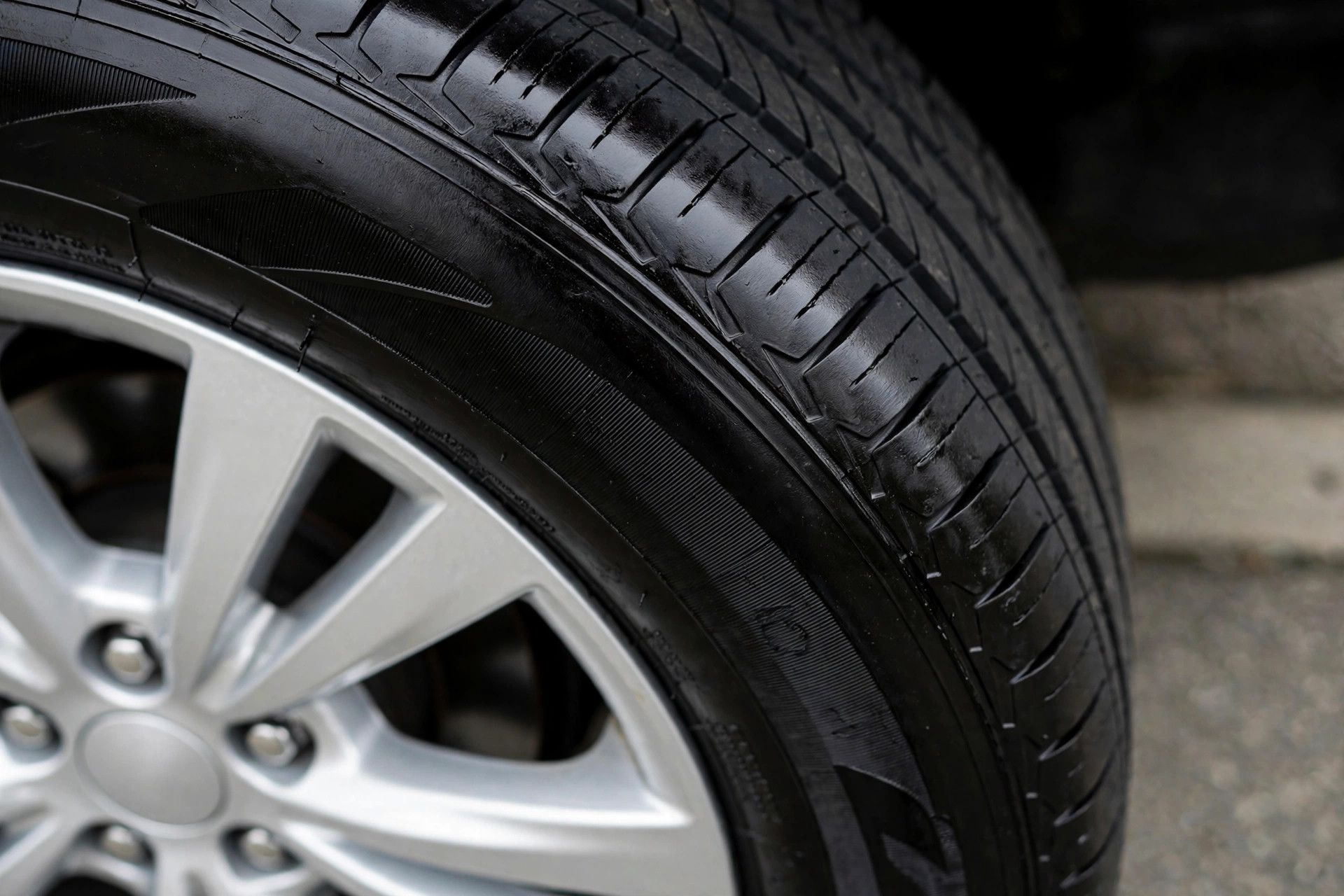 Clean deep-black tire with water-based dressing